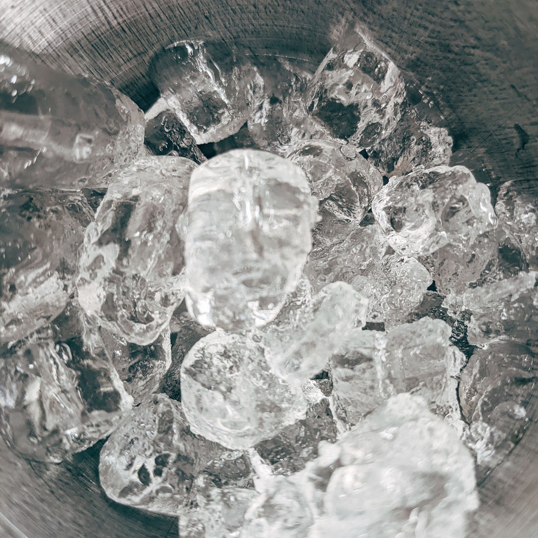 Ice cubes in a metal bowl